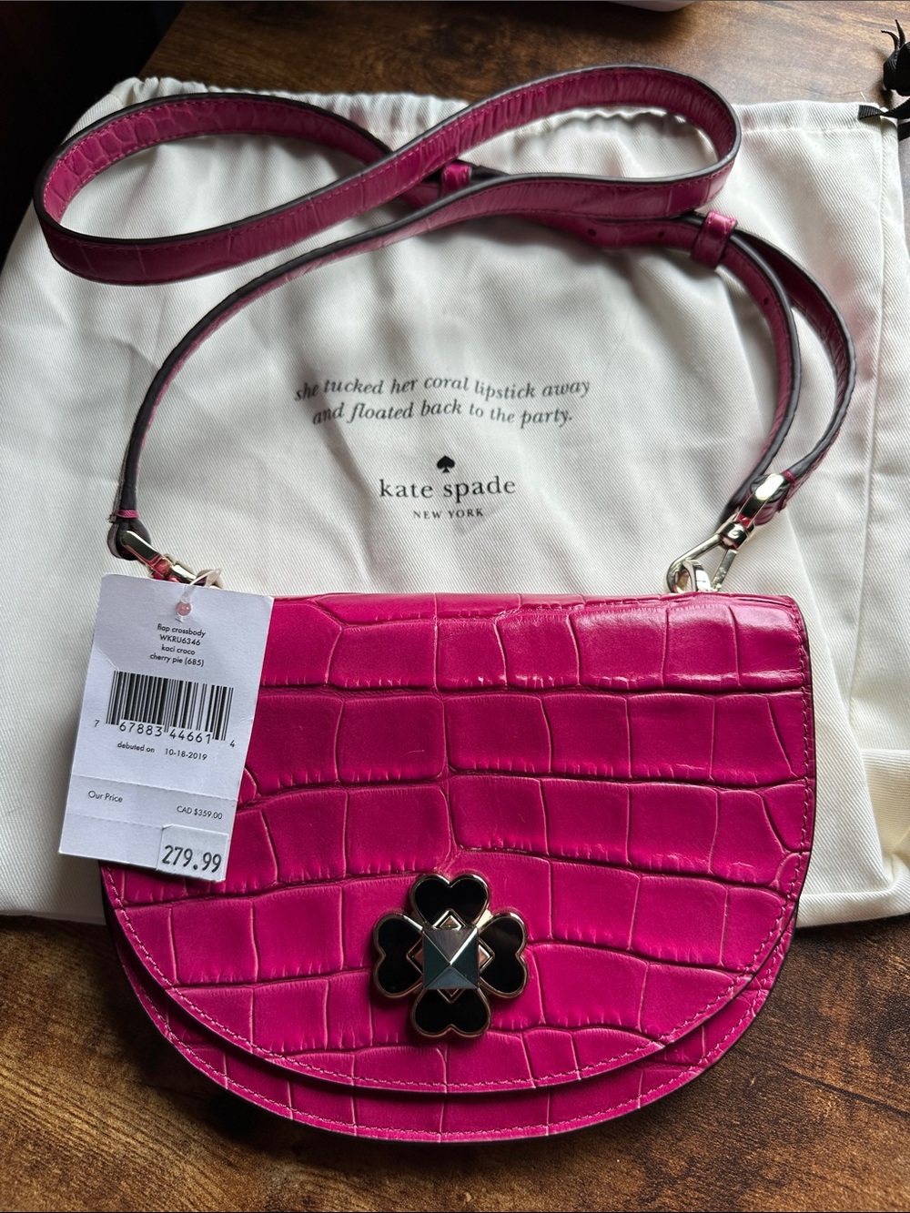 kate spade fuchsia croc-embossed crossbody with floral clasp